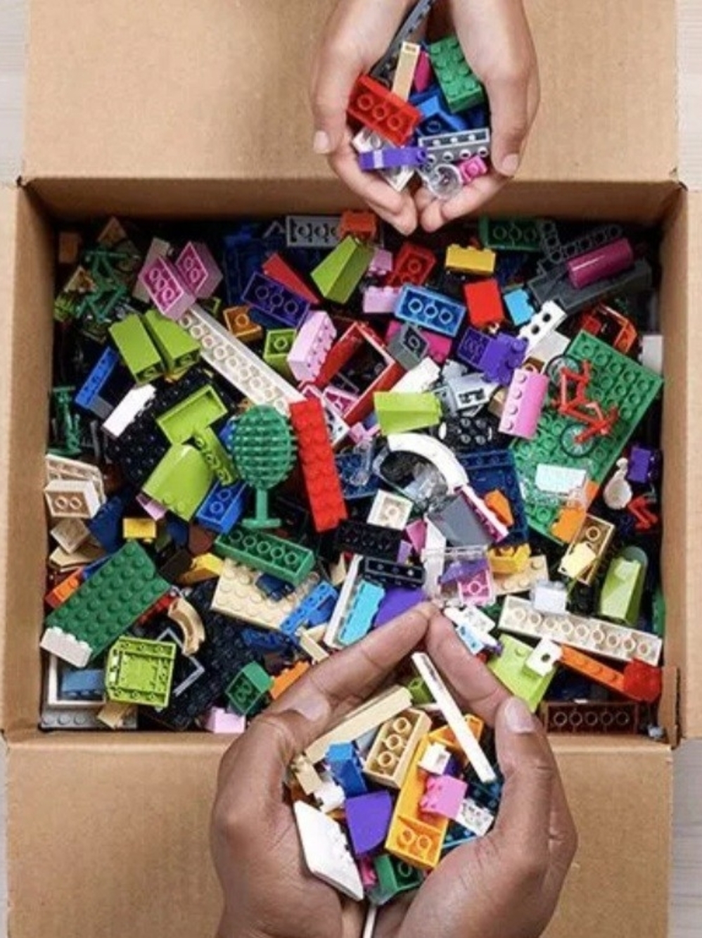 A Box Of Mixed Legos And Mini Figurines